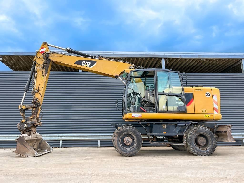 CAT M318F Bagri na kolesih