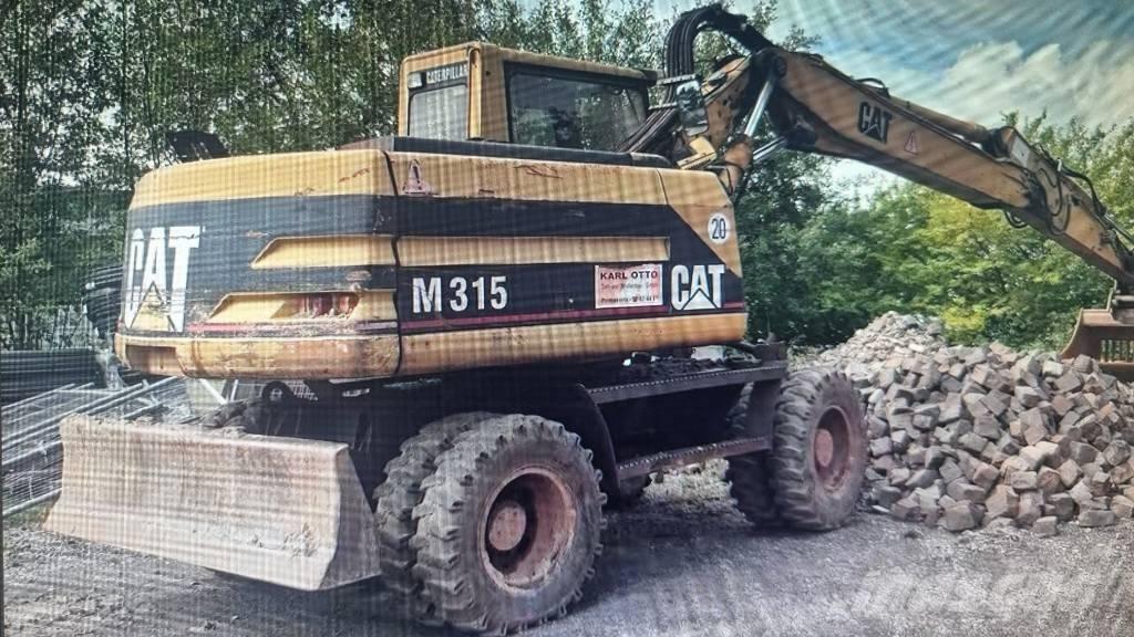 CAT M 315 Bagri na kolesih