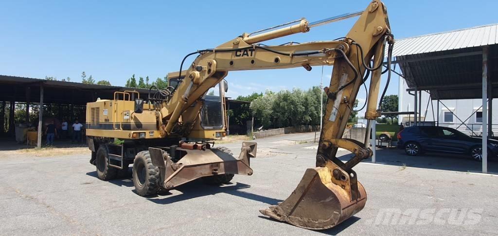CAT 214 B Bagri na kolesih