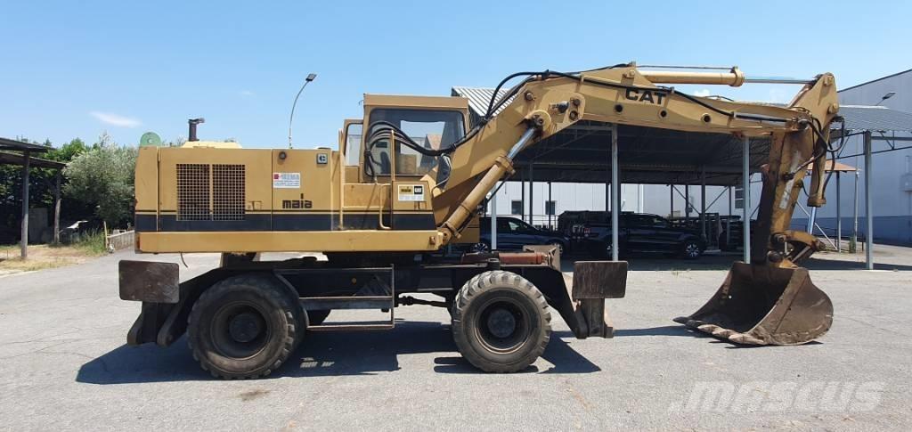 CAT 214 B Bagri na kolesih