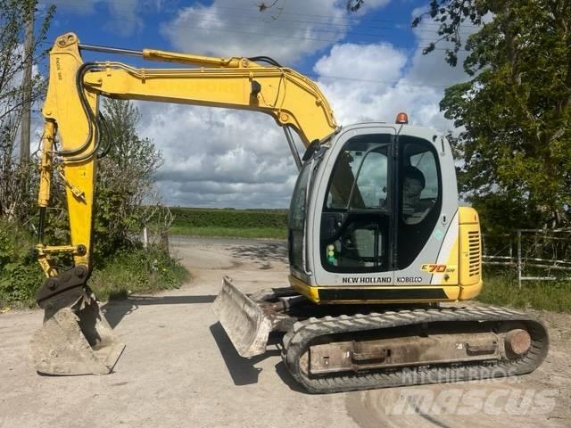 New Holland E 70 SR Midi bagri 7t – 12t