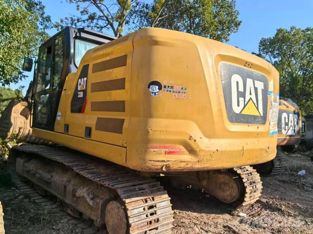CAT 323 Bagri goseničarji