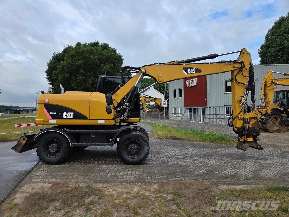 CAT M313D Bagri na kolesih