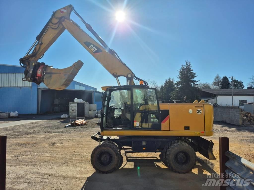 CAT M322F Bagri na kolesih