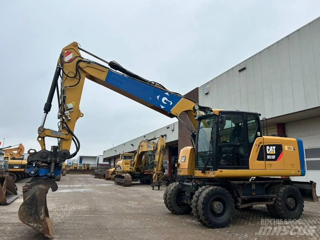 CAT M 318 F Bagri na kolesih