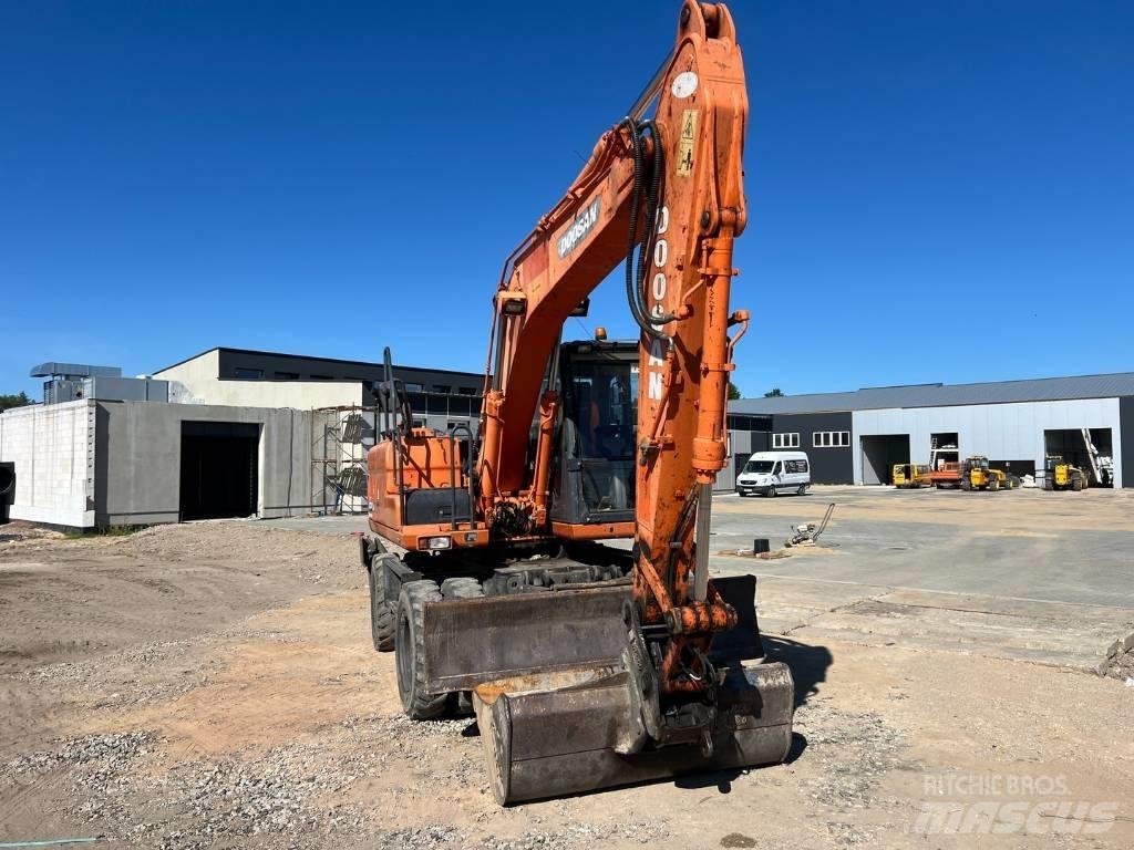 Doosan DX 140 W Bagri na kolesih