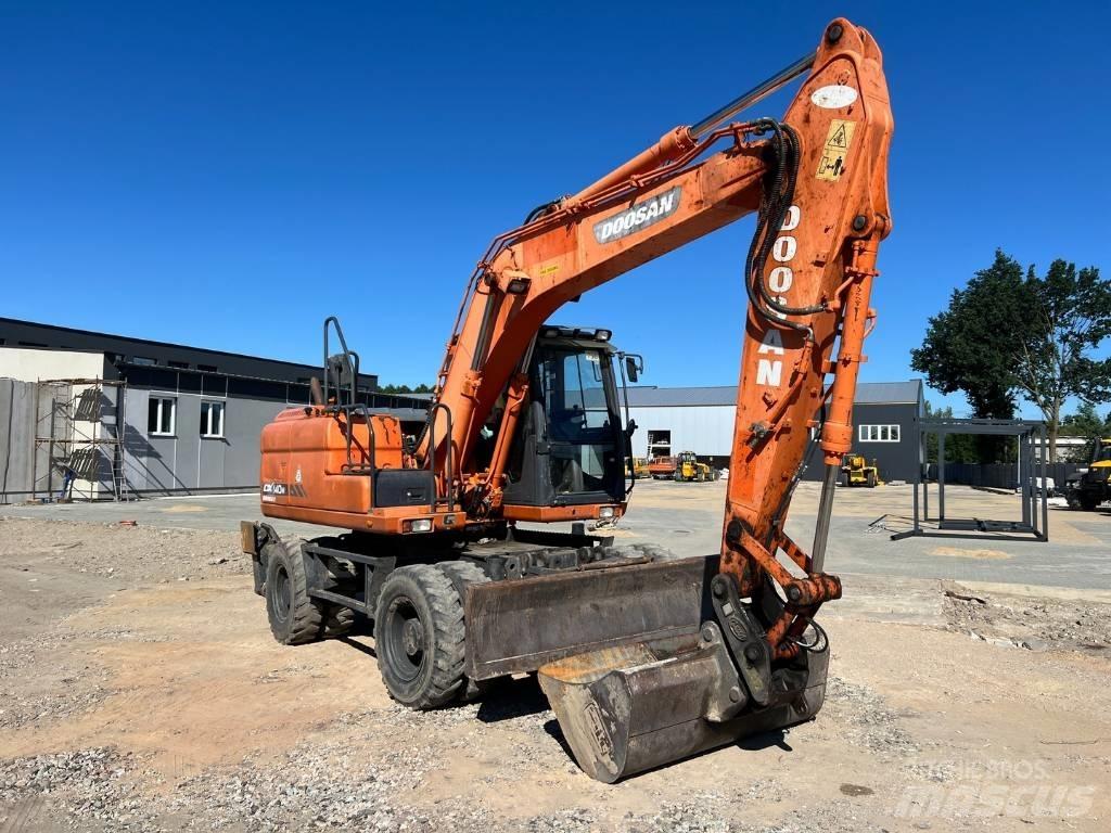 Doosan DX 140 W Bagri na kolesih