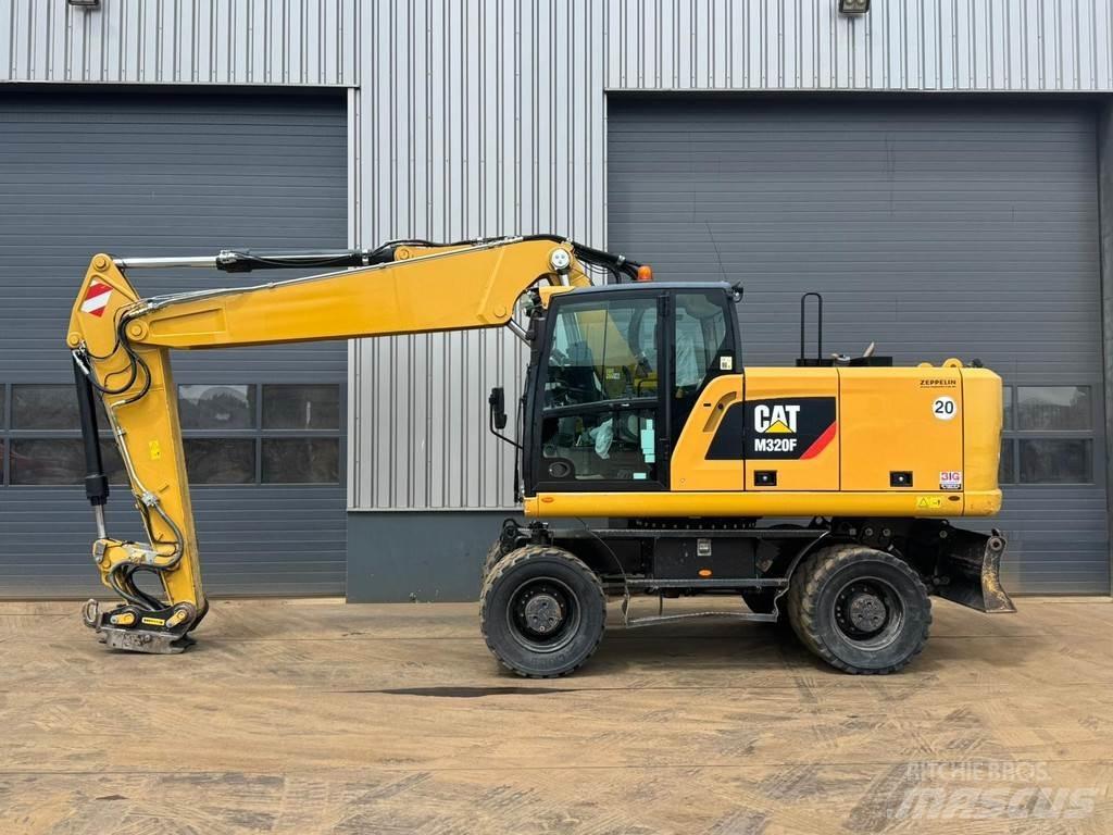 CAT M320F Bagri na kolesih