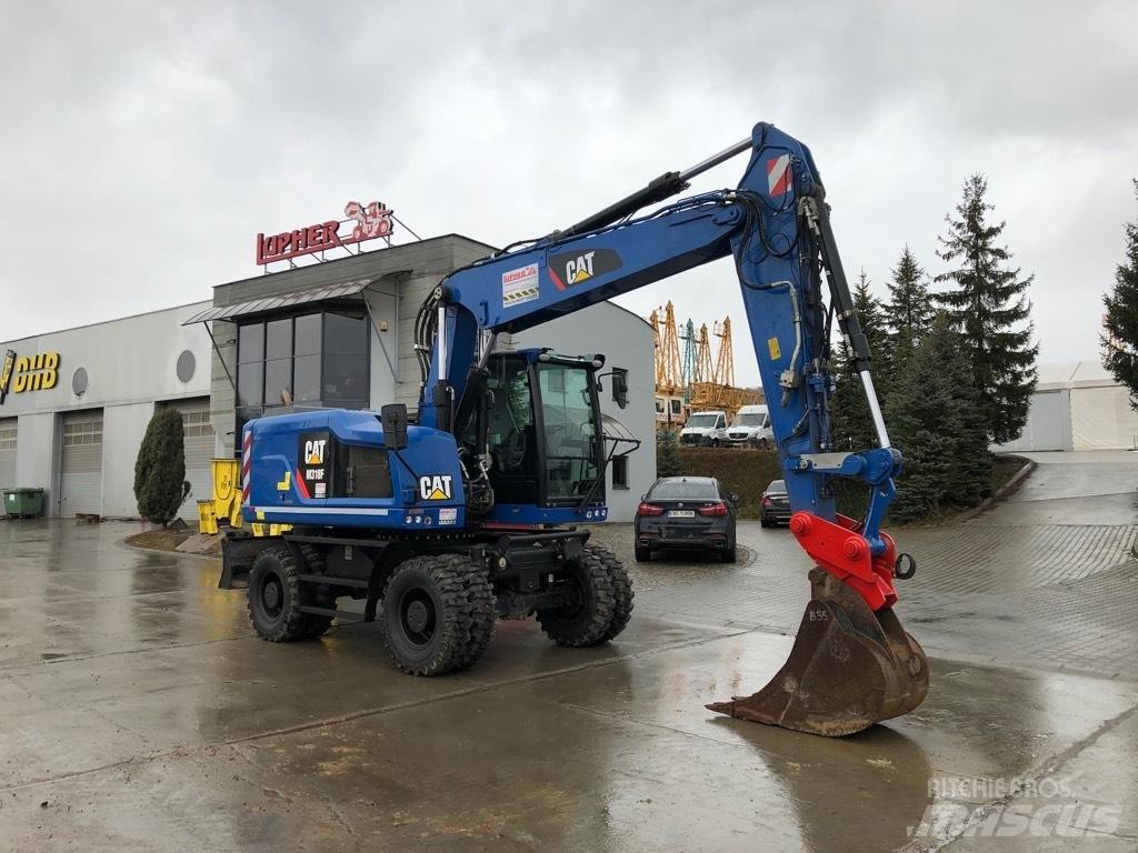 CAT M318F Bagri na kolesih