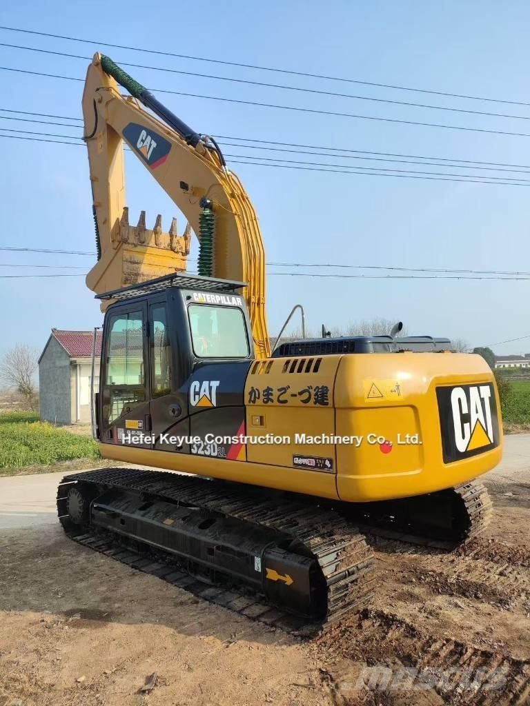 CAT 323 Bagri goseničarji