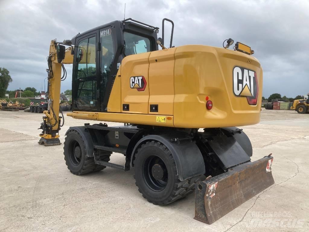 CAT M314 Bagri na kolesih