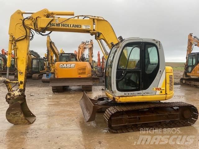 New Holland E 70 SR Midi bagri 7t – 12t