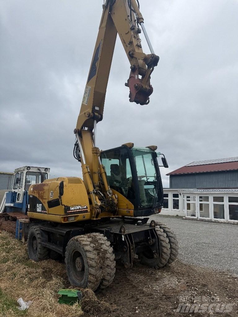 CAT M 313 C Bagri na kolesih