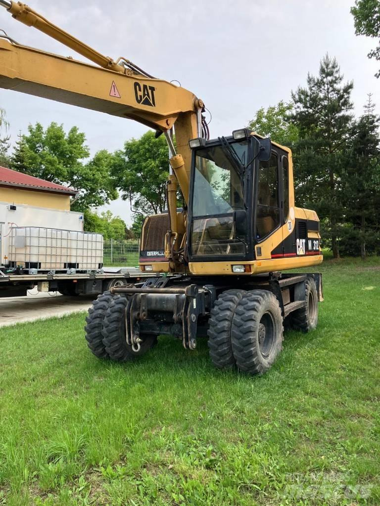 CAT M 312 Bagri na kolesih