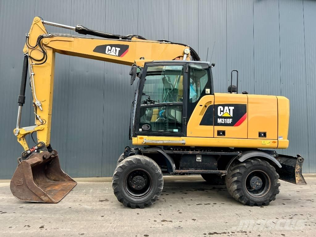 CAT M318F Bagri na kolesih