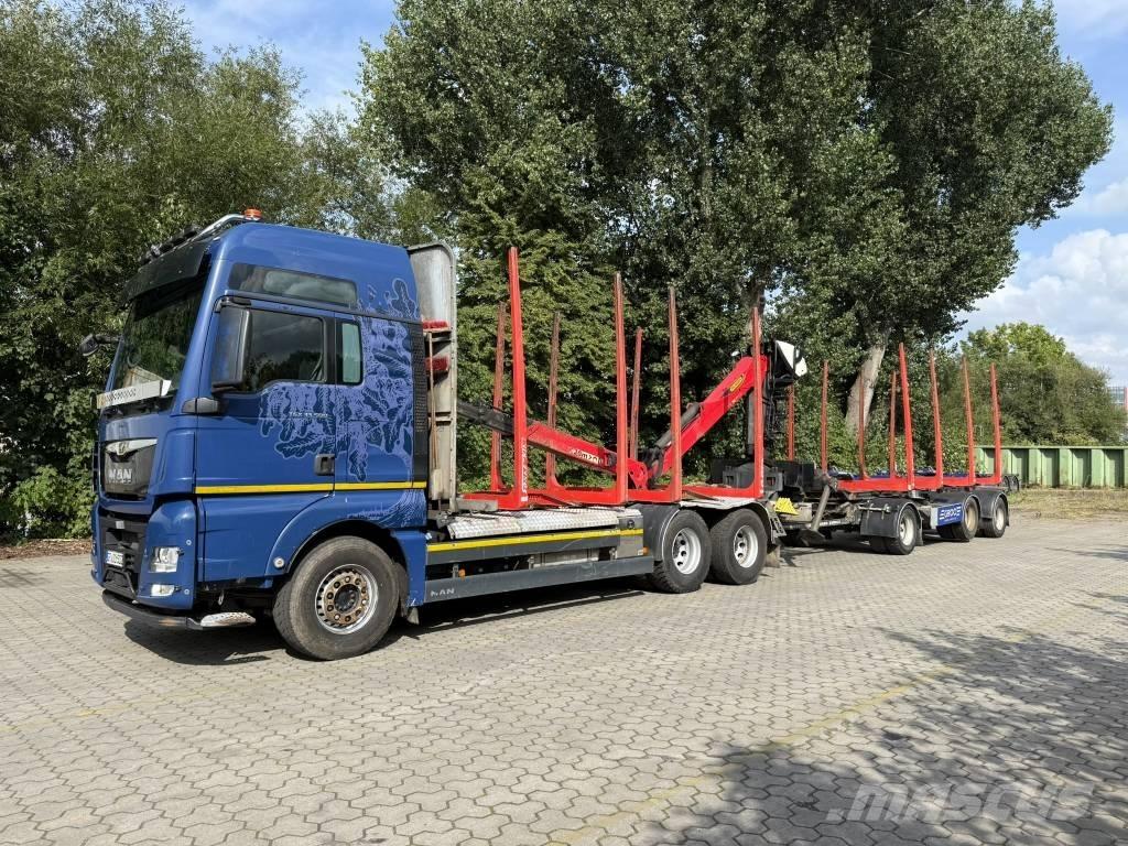 MAN TGX 33.500 Tovornjaki za prevoz gozdnih strojev