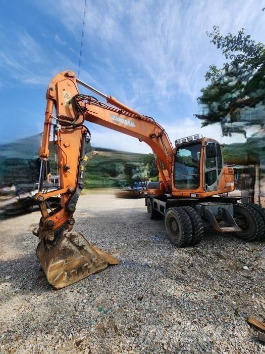 Doosan DX 140 W Bagri na kolesih