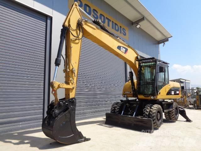 CAT M 318 D Bagri na kolesih