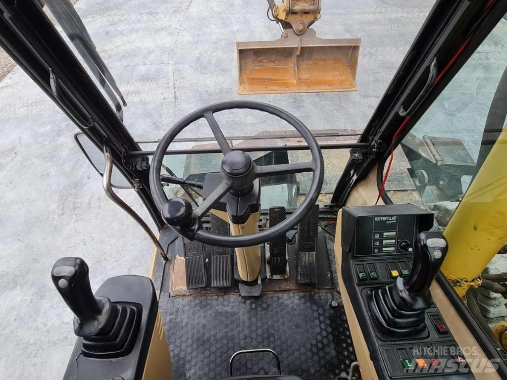 CAT M 312 Bagri na kolesih