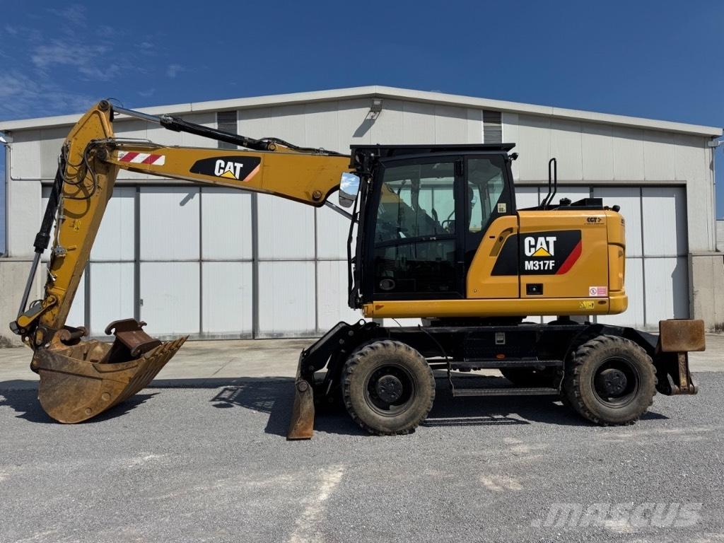 CAT M317F Bagri na kolesih