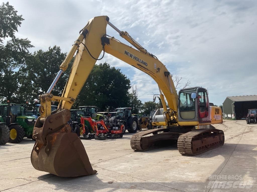 New Holland E 305 Bagri goseničarji