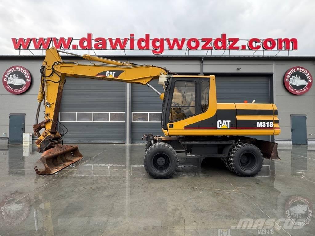 CAT M 318 Bagri na kolesih