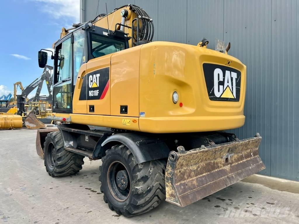 CAT M318F Bagri na kolesih