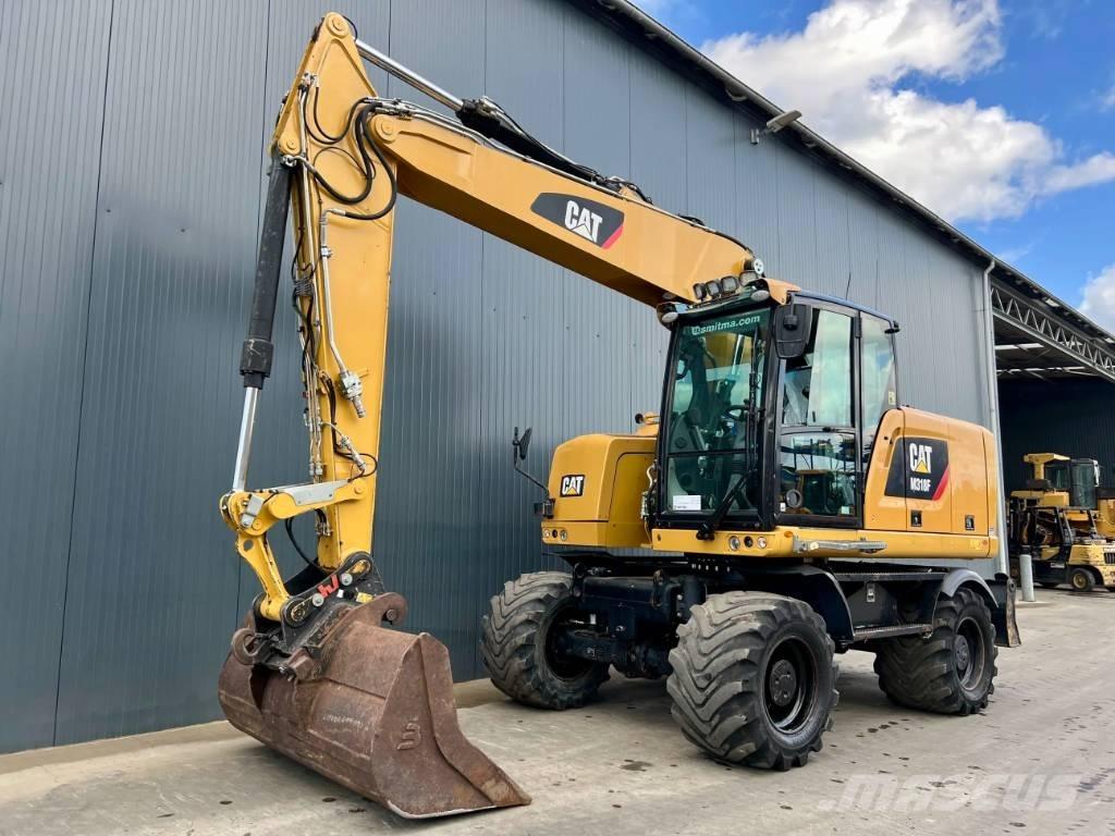 CAT M318F Bagri na kolesih