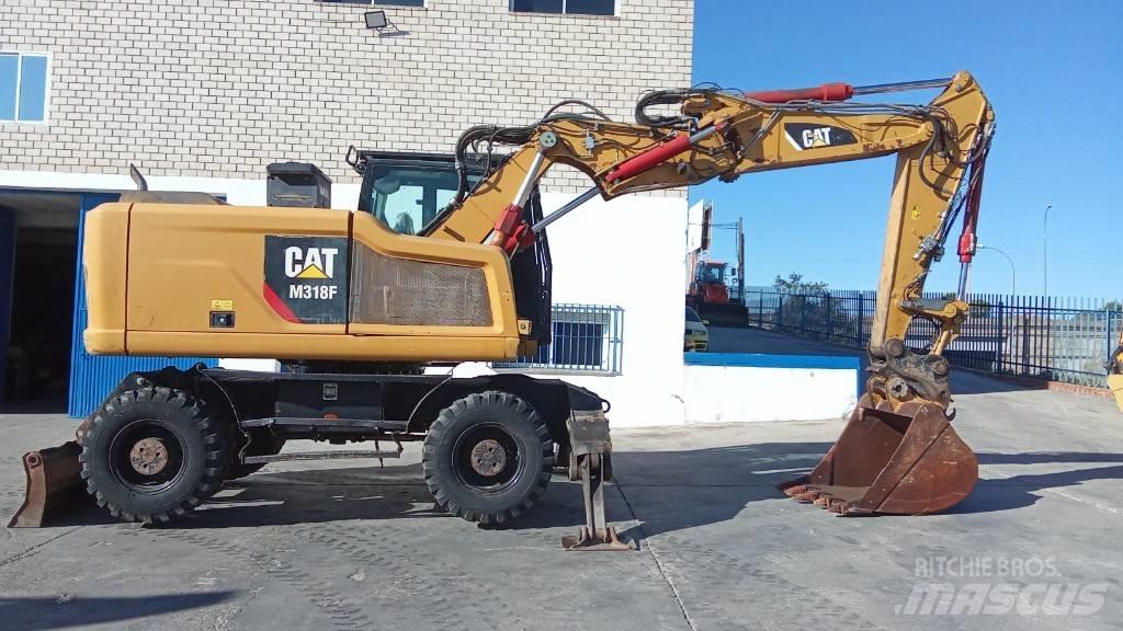 CAT M318F Bagri na kolesih