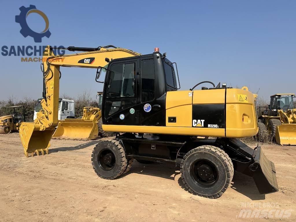 CAT M320D Bagri na kolesih