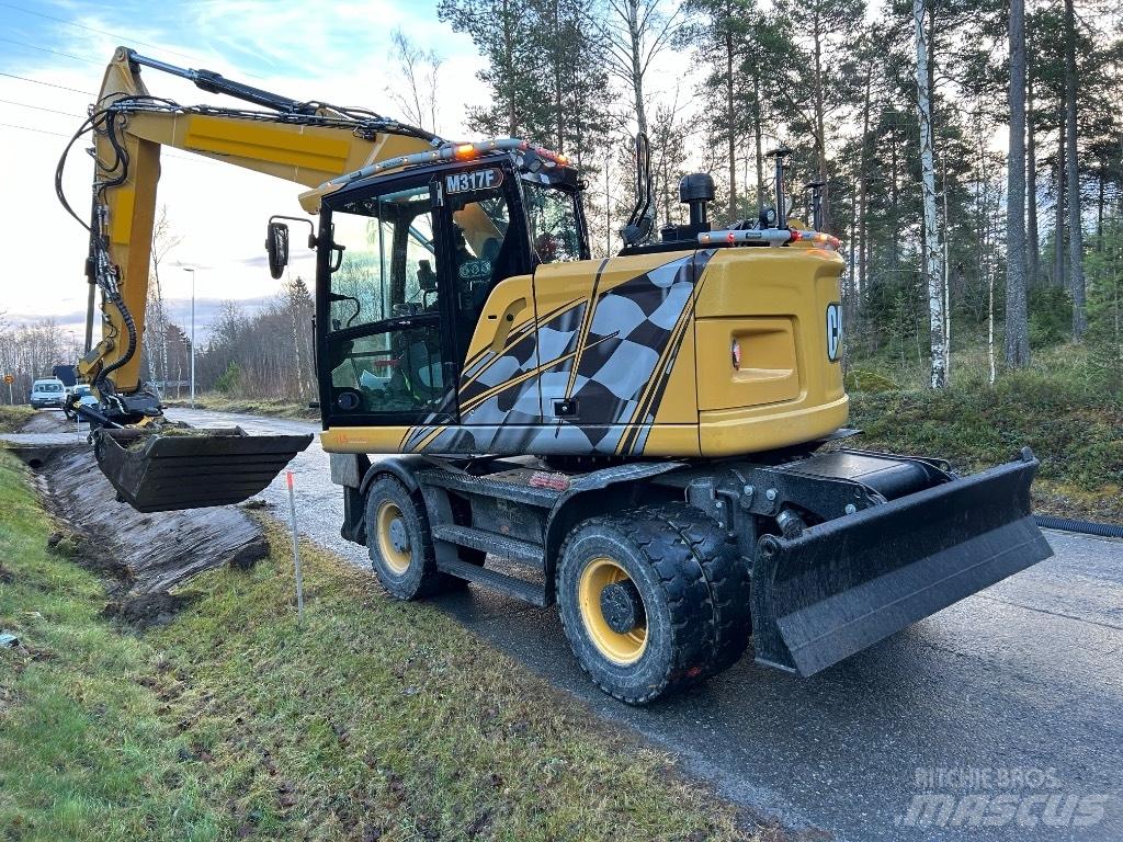 CAT M 317F Bagri na kolesih