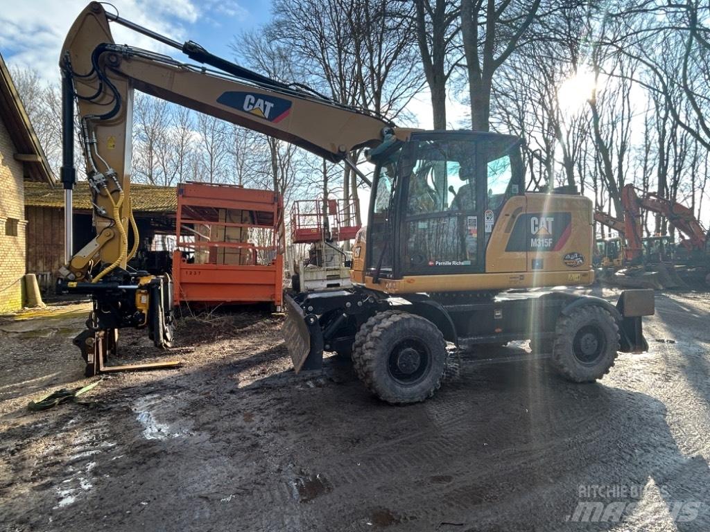 CAT M315 Bagri na kolesih