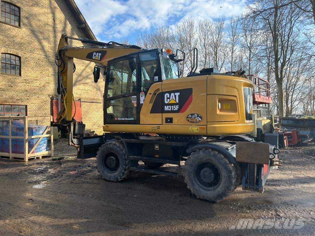 CAT M315F Bagri na kolesih