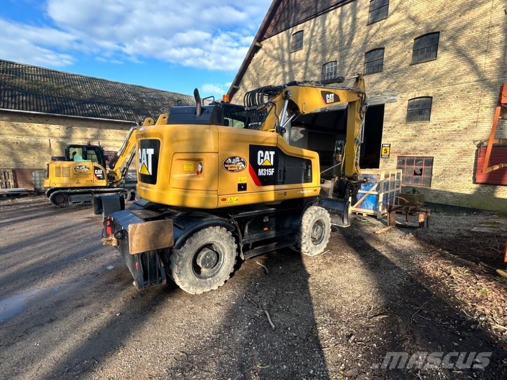 CAT M315F Bagri na kolesih