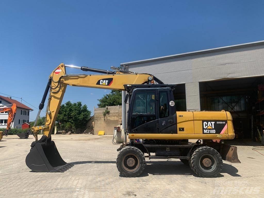 CAT M 318 D Bagri na kolesih