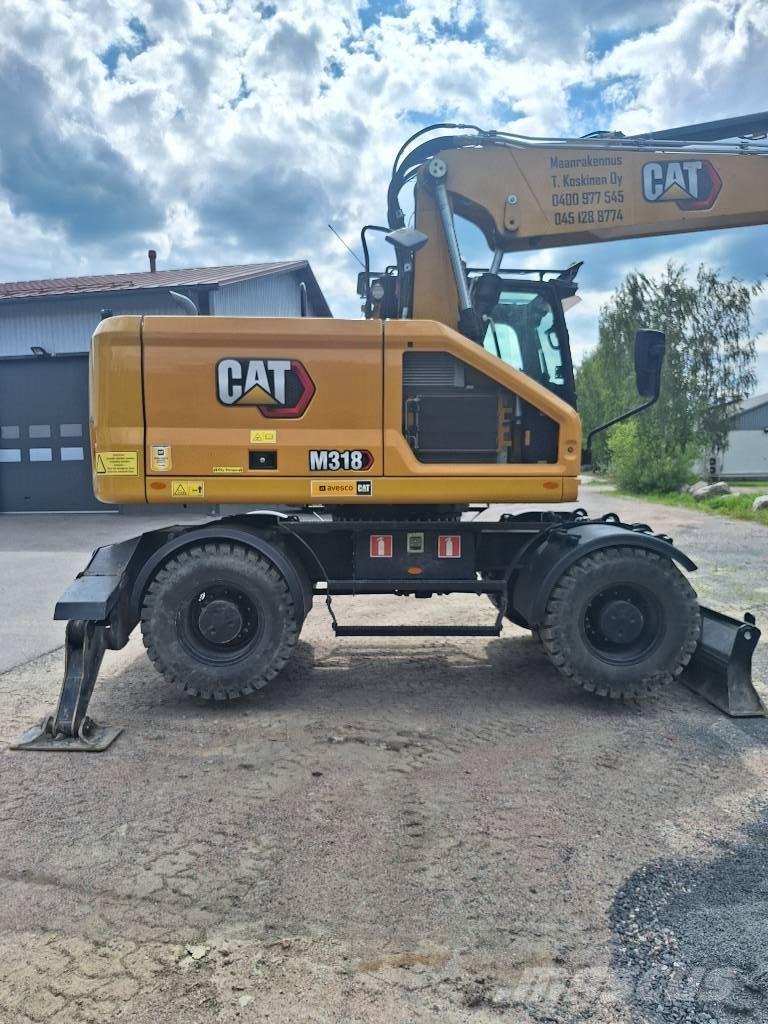 CAT M 318 Bagri na kolesih