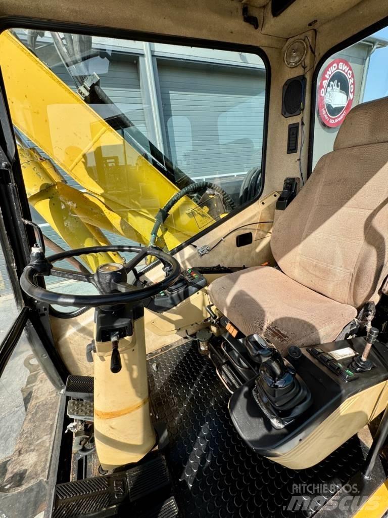 CAT M 312 Bagri na kolesih