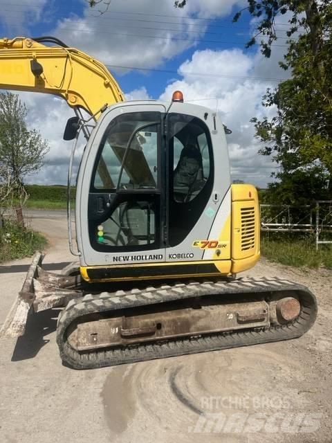 New Holland E 70 SR Midi bagri 7t – 12t