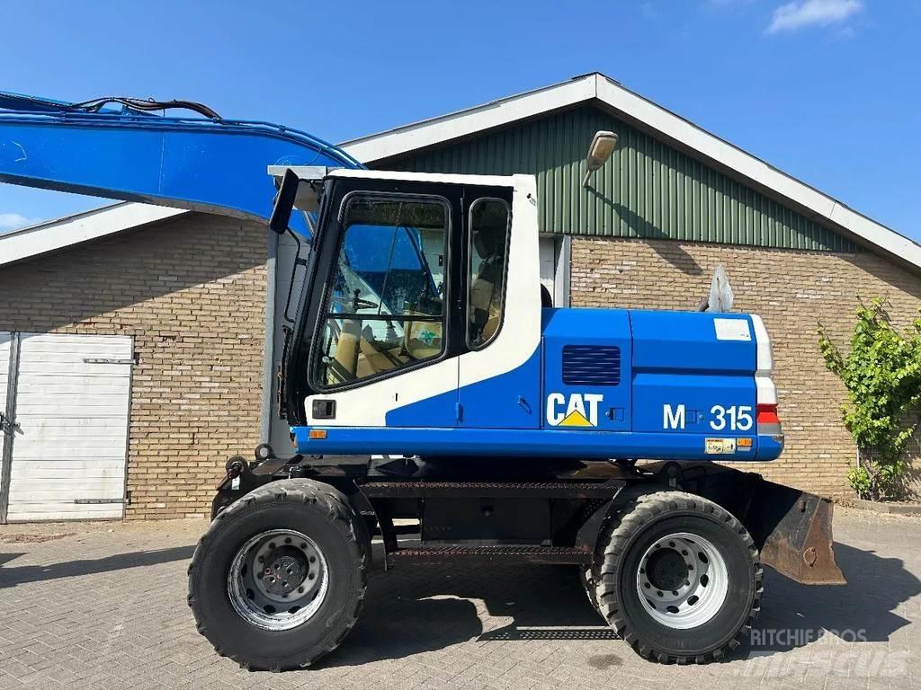 CAT M315 Bagri na kolesih