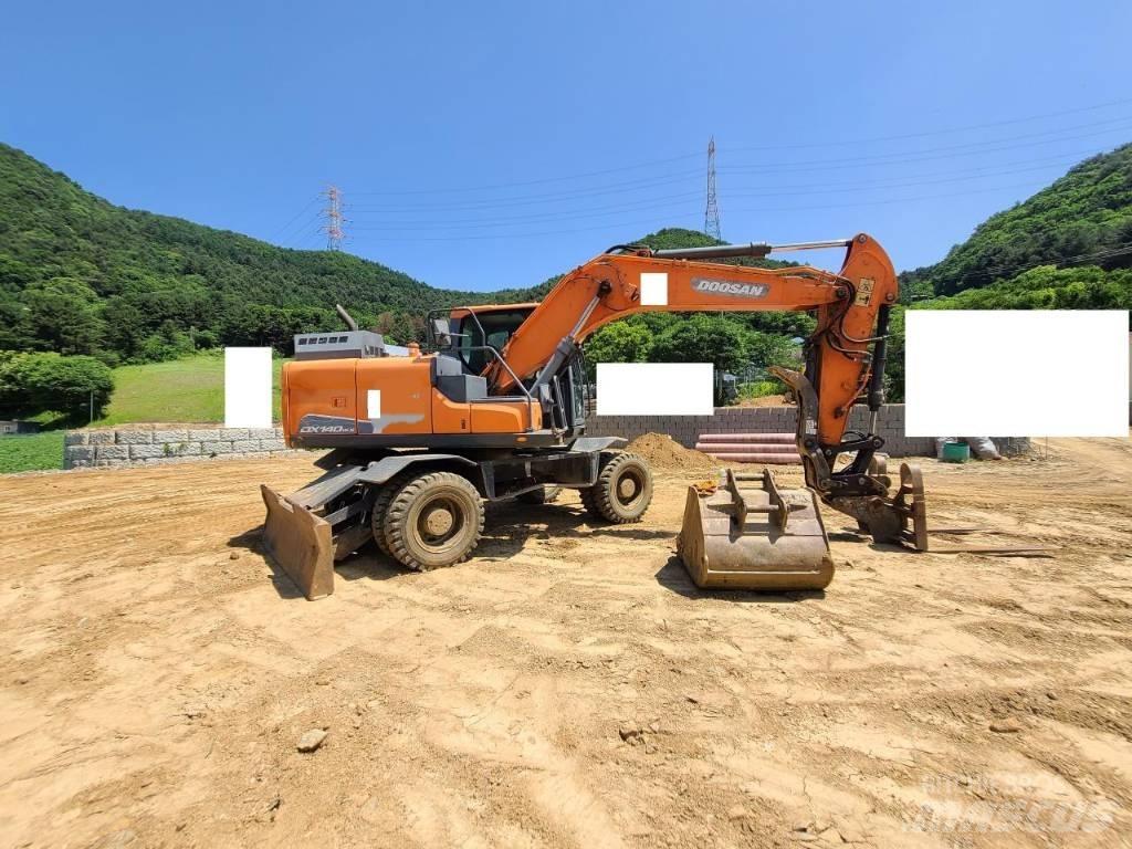Doosan DX 140 W Bagri na kolesih