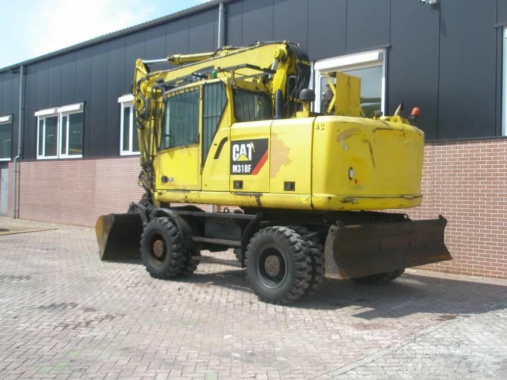 CAT M318F Bagri na kolesih