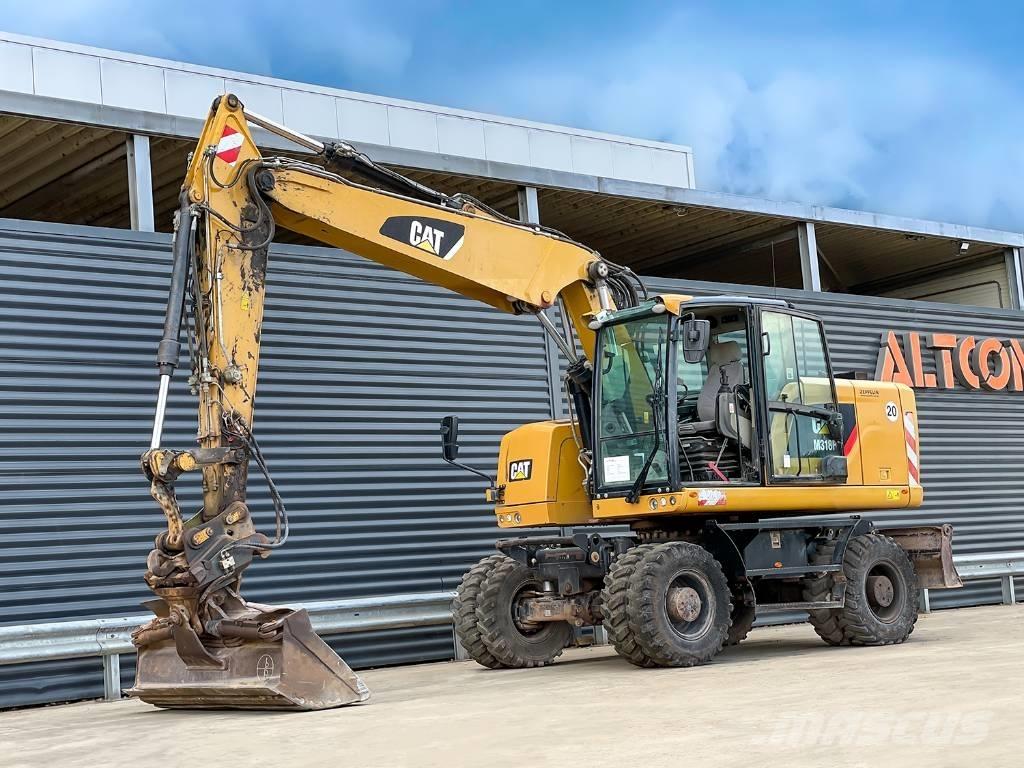 CAT M318F Bagri na kolesih