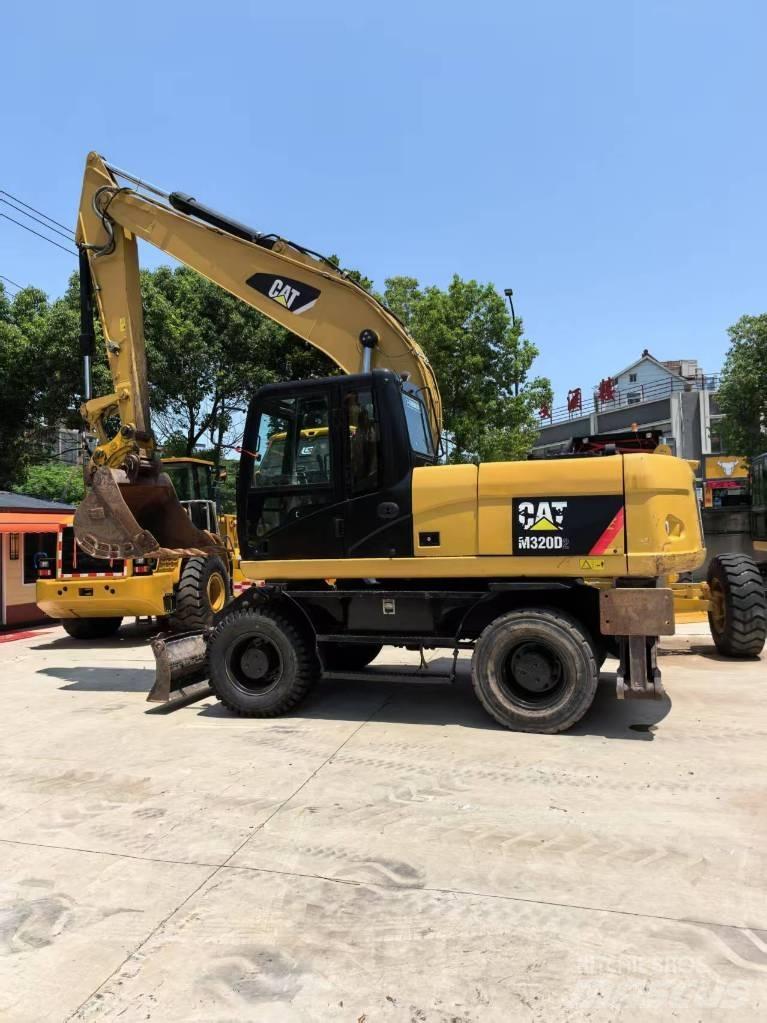 CAT M 320 Bagri na kolesih