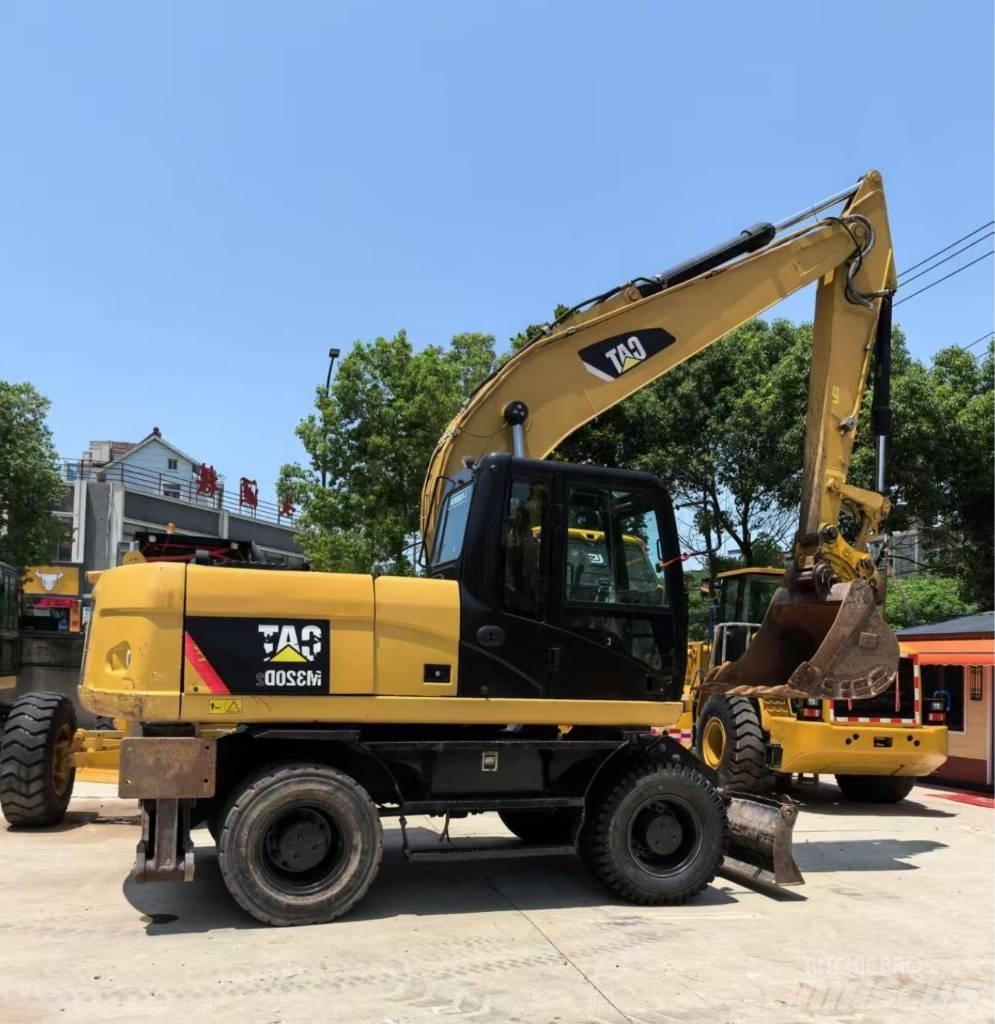 CAT M 320 Bagri na kolesih