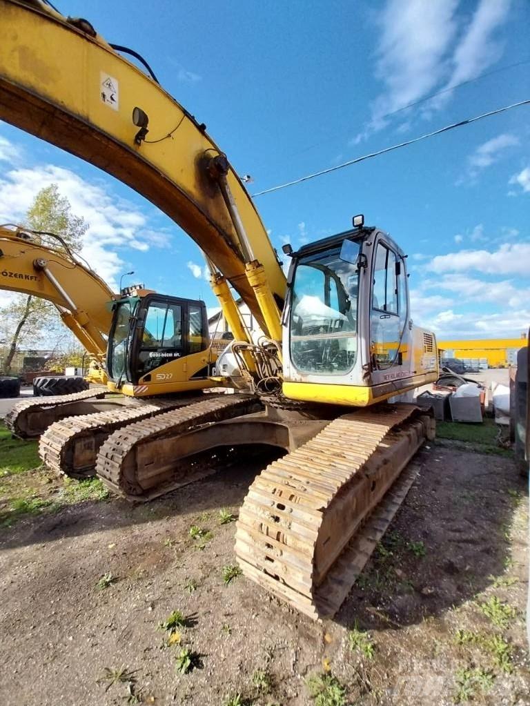 New Holland E 305 Bagri goseničarji