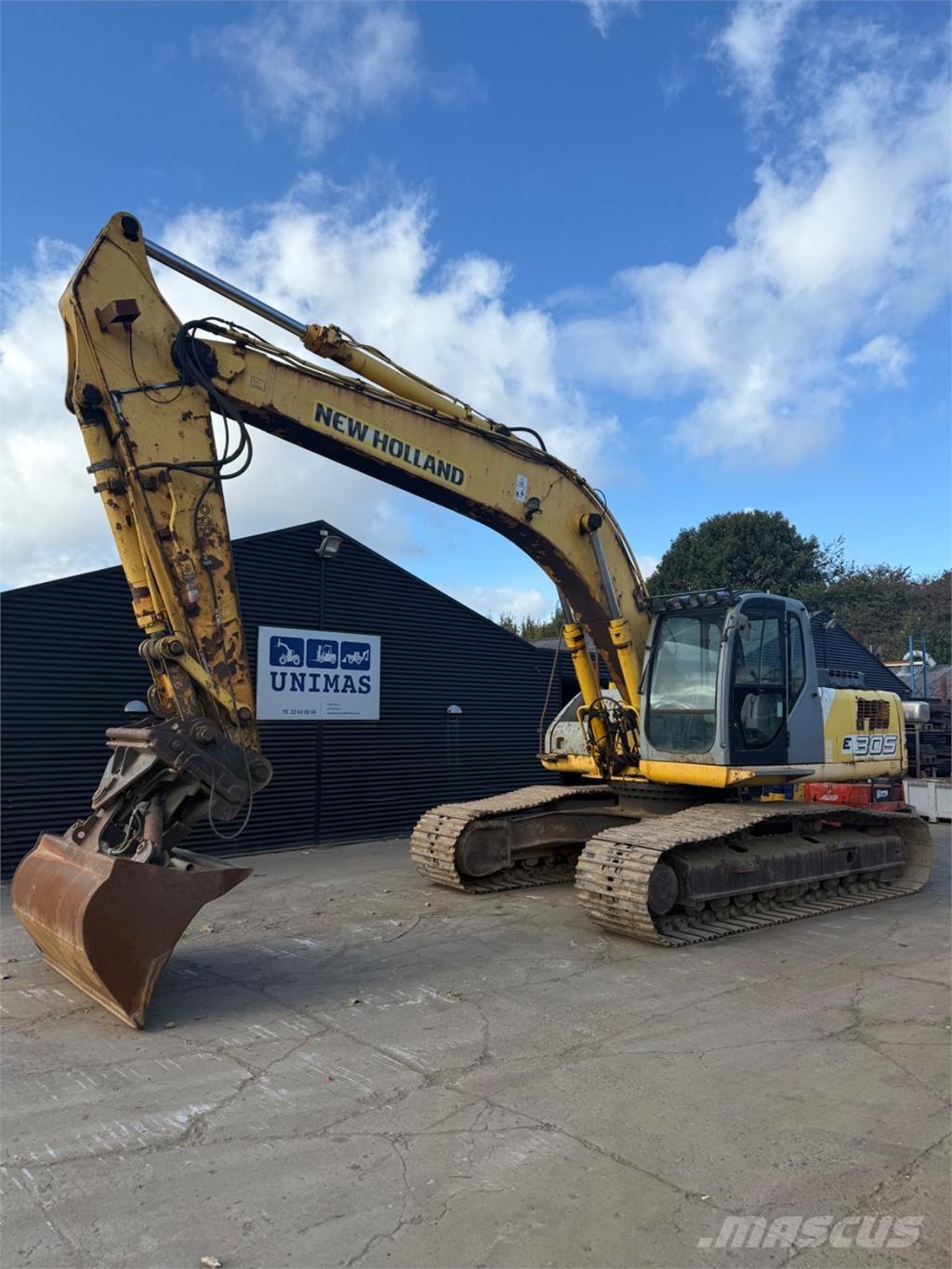 New Holland E305 Bagri goseničarji