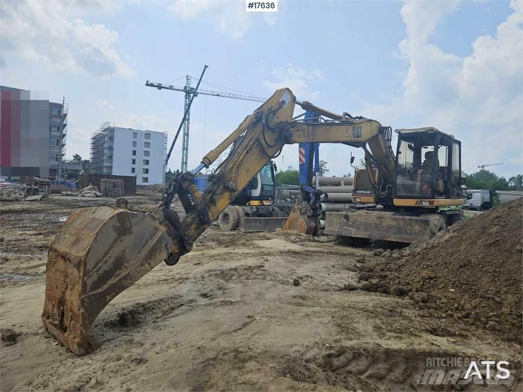 CAT M312 Bagri na kolesih
