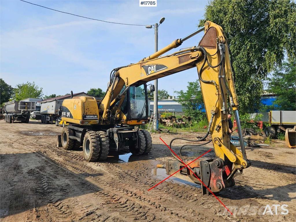 CAT M313 C Bagri na kolesih