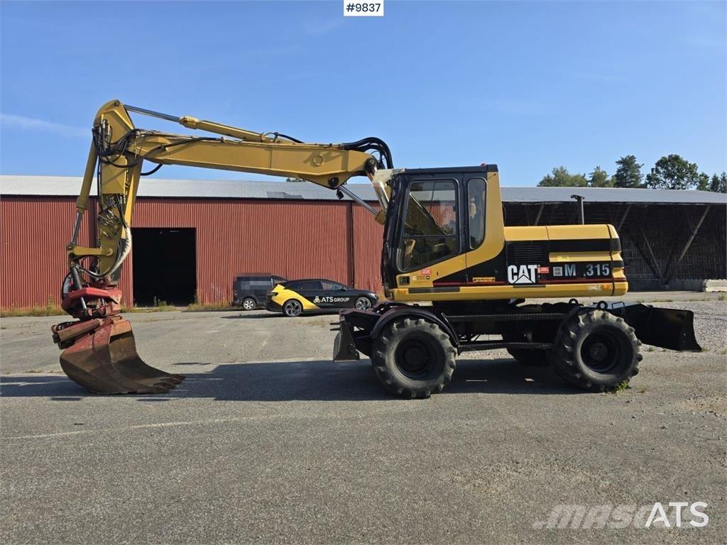CAT M315 Bagri na kolesih