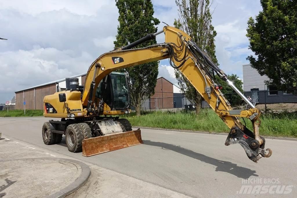 CAT M313 D Bagri na kolesih